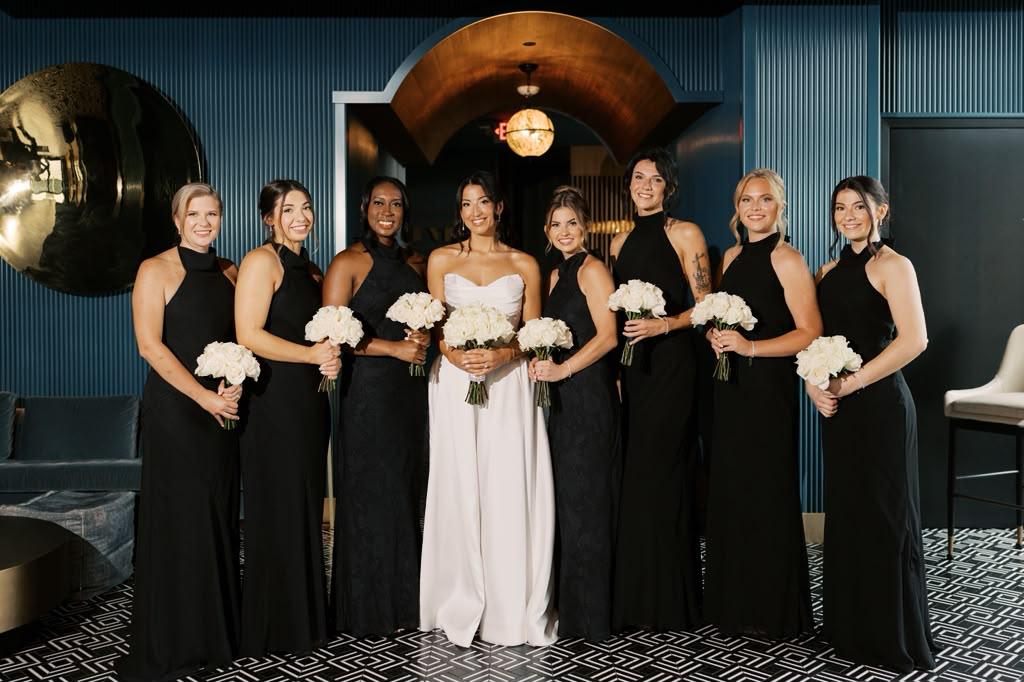 Bride and her bridal party in black dresses