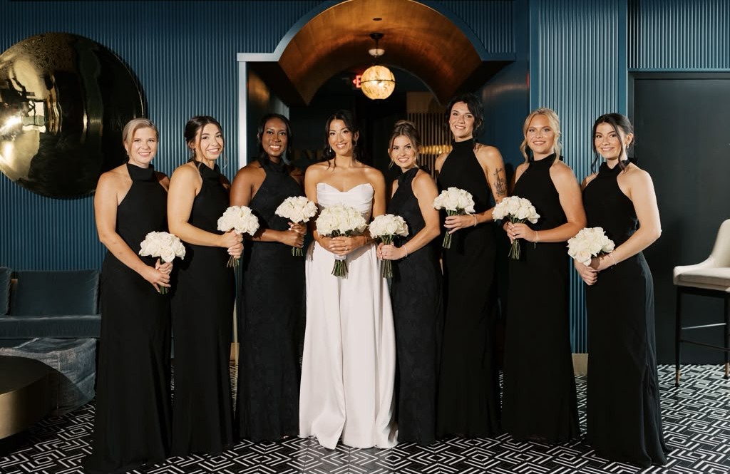 Bride with her bridal party in black dresses