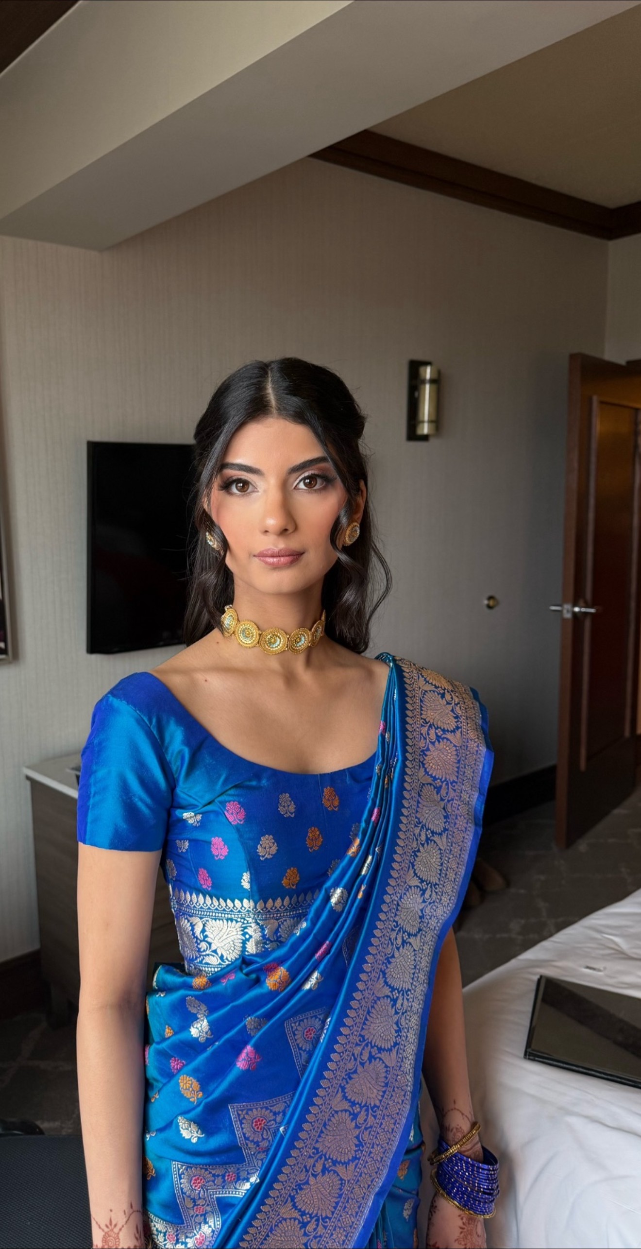 Indian bridal makeup with a blue saree