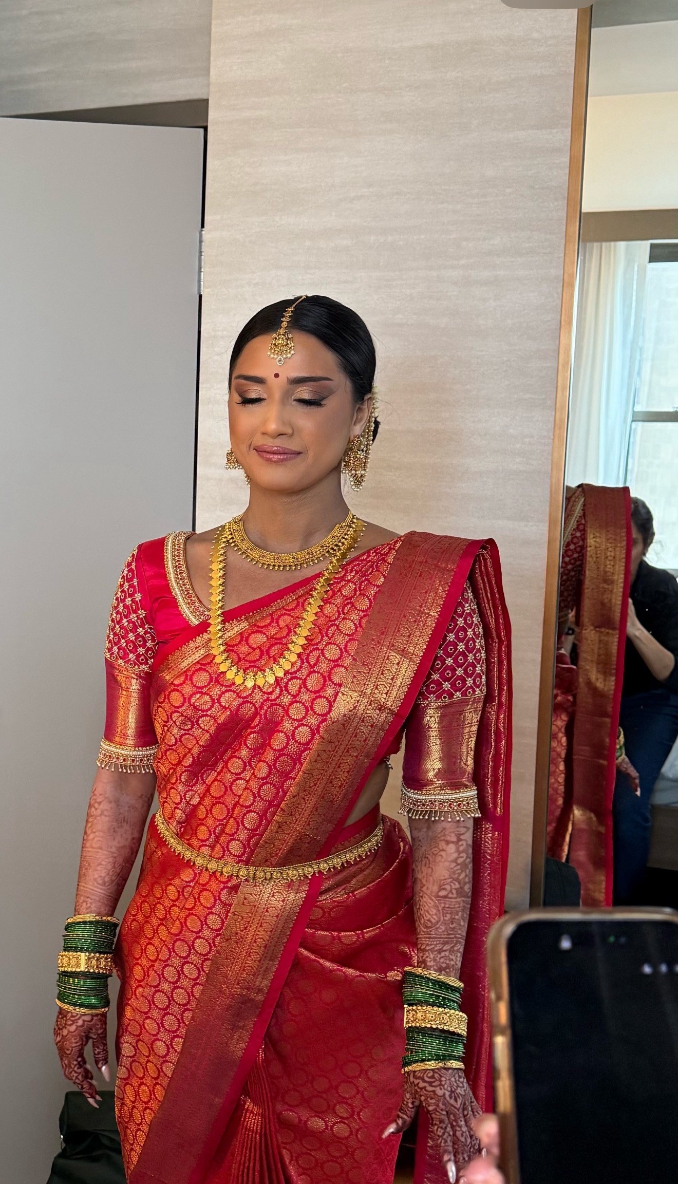 Indian bridal makeup with a red saree